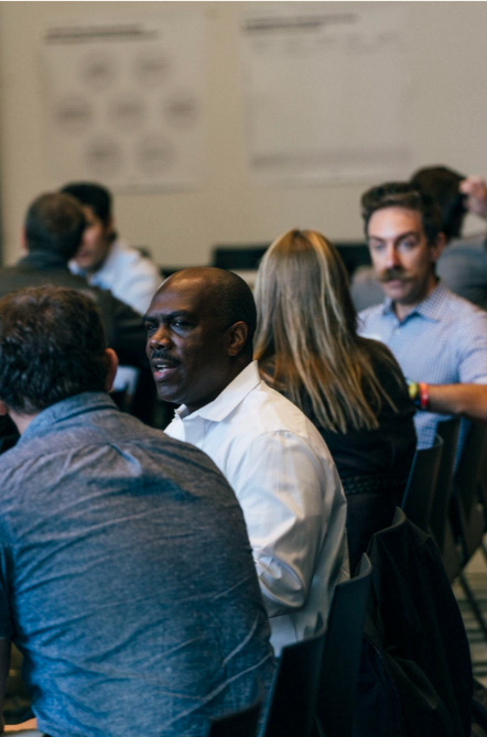 Leaders forming partnerships at a convening